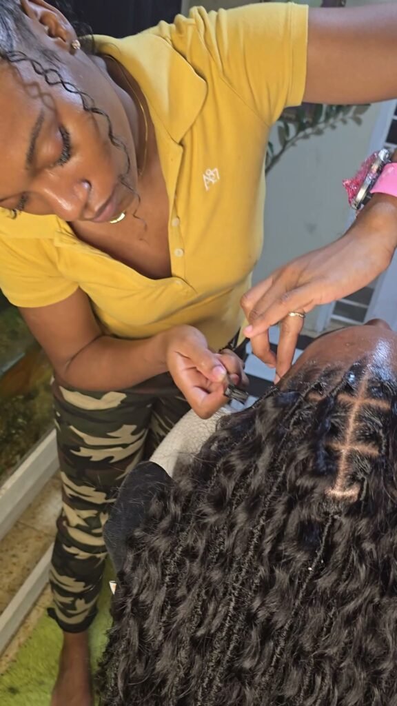 Jo installing boho locs during a client install